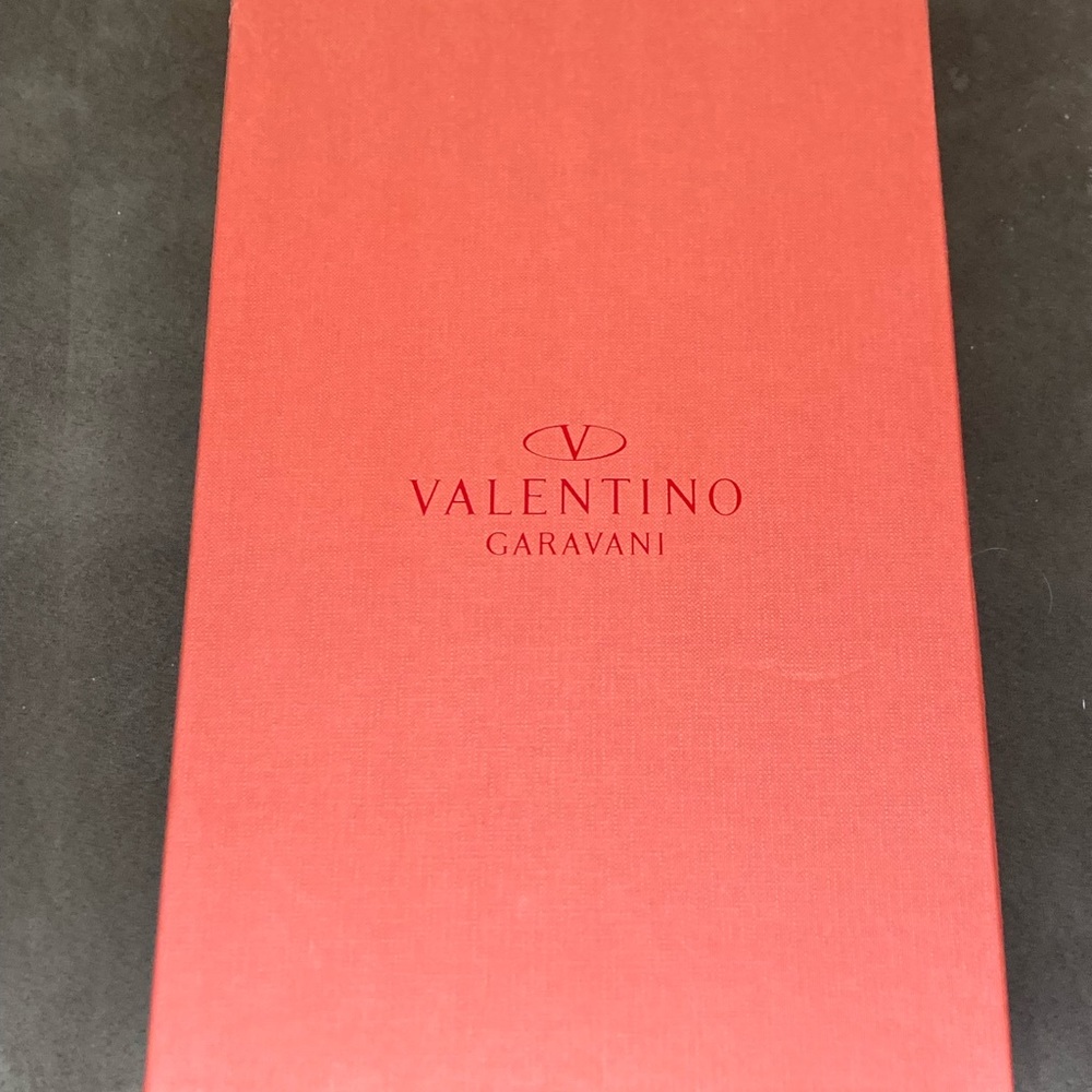 Empty Red Garavani Valentino shoebox with dust bag
